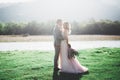 Wedding couple, groom and bride hugging, outdoor near river Royalty Free Stock Photo