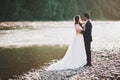 Wedding couple, groom and bride hugging, outdoor near river Royalty Free Stock Photo