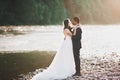 Wedding couple, groom and bride hugging, outdoor near river Royalty Free Stock Photo