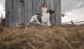 Wedding couple, groom and bride near wedding arch on a background mountain river