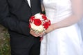 Wedding couple holding bouquet Royalty Free Stock Photo