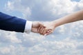 Wedding couple holding hands on blue sky with clouds Royalty Free Stock Photo
