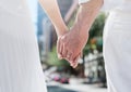 Wedding couple holding hands in city Royalty Free Stock Photo