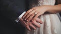 Wedding couple holding hands. Close-up photo of bride and groom holding hands