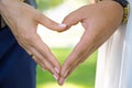 Wedding couple holding hands on nature background.