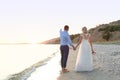 Wedding couple holding hands at sunset Royalty Free Stock Photo