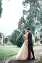 Wedding couple kissing in the park in the rain Royalty Free Stock Photo