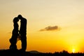 Wedding couple kissing with sunset