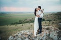 Wedding couple looking in mountain hill on sunset Royalty Free Stock Photo