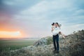 Wedding couple looking in mountain hill on sunset Royalty Free Stock Photo