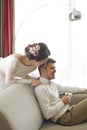 Wedding couple in love. Beautiful bride in white dress with handsome groom. Bright interior