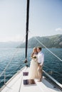 Wedding couple on the luxury yacht sailing down the sea, Montenegro Royalty Free Stock Photo