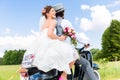 Wedding couple on motor scooter just married Royalty Free Stock Photo