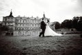 Wedding couple next to castle in west Ukraine