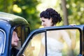 A wedding couple in old car Royalty Free Stock Photo