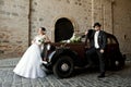 Wedding couple with old car Royalty Free Stock Photo