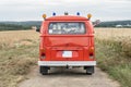 Wedding Couple in Oldtimer VW T1 fire engine red firefigther car classic car drivin on the Road