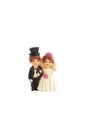 Wedding couple. A plastic toy miniature of a wedding couple isolated on white background Royalty Free Stock Photo