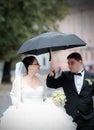 Wedding couple in rain Royalty Free Stock Photo