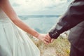 Romantic young couple enjoying sun near river