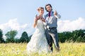 Wedding couple showing horse shoe