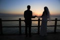 Wedding couple silhouette against sunset and blue sky Royalty Free Stock Photo