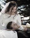 Dreamy Wedding Couple Sitting on a Bench Royalty Free Stock Photo