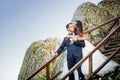 Wedding couple standing in the mountains against the sky. Cute r Royalty Free Stock Photo