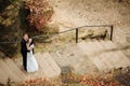 Wedding couple standing in the mountains against the sky. Cute romantic moment. Best day in the life of the bride. Royalty Free Stock Photo