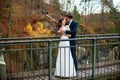 Wedding couple standing in the mountains against the sky. Cute romantic moment. Best day in the life of the bride. Royalty Free Stock Photo