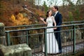 Wedding couple standing in the mountains against the sky. Cute romantic moment. Best day in the life of the bride. Royalty Free Stock Photo