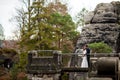 Wedding couple standing in the mountains against the sky. Cute romantic moment. Best day in the life of the bride. Royalty Free Stock Photo