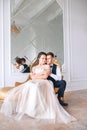 Wedding couple on the studio. Wedding day. Happy young bride and groom on their wedding day. Wedding couple - new family. Royalty Free Stock Photo