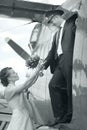 Wedding couple in vintage aircraft