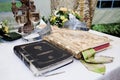 Wedding crowns, bible and wine glasses