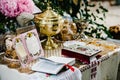 Wedding crowns in church ready for marriage ceremony. close up. Bible, crown, bowl, Certificate of the glans in the church on