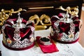 Wedding crowns in church ready for marriage ceremony. close up. crown, bowl in the church on table