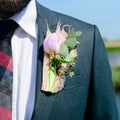 Wedding day. Beautiful creative groom boutonniere on the suit of Royalty Free Stock Photo
