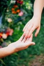 Wedding day. Bride and groom, love concept. Young family. Newlyweds hands. Outdoor wedding ceremony. Married couple. Wedding rings Royalty Free Stock Photo