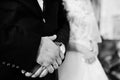 Wedding day. Hands in hands of newlywed couple Royalty Free Stock Photo