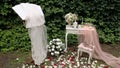 Wedding decor with antique table, flowers and veil.