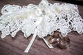 Wedding. Decor. Bride`s shoes, a beautiful wedding bouquet, rings, boutonniere and jewelry are beautifully laid out on a Royalty Free Stock Photo