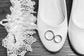Wedding. Decor. Bride`s shoes, a beautiful wedding bouquet, rings, boutonniere and jewelry are beautifully laid out on a Royalty Free Stock Photo