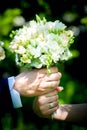 Wedding. Decor. Bride`s shoes, a beautiful wedding bouquet, rings, boutonniere and jewelry are beautifully laid out on a Royalty Free Stock Photo