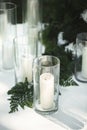 Wedding decor: delicate flowers and burning candles Royalty Free Stock Photo