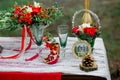 Wedding decor with green glasses, fruit, flowers on a table in s