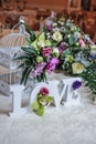 Wedding decor, LOVE letters and flowers on table. Fresh flowers and LOVE decoration on festive table. Luxurious wedding decoration