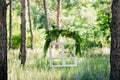 Wedding decor with an old window, a beads, a juniper, herbs, mountain ash and apples