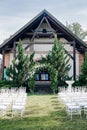 Wedding decor, a place for a wedding ceremony in nature, in the garden. Wedding arch made of fresh flowers, floristry. Royalty Free Stock Photo