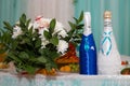 wedding decor on the table of the newlyweds. champagne in the form of a bride and groom. wedding flowers. blue wedding Royalty Free Stock Photo